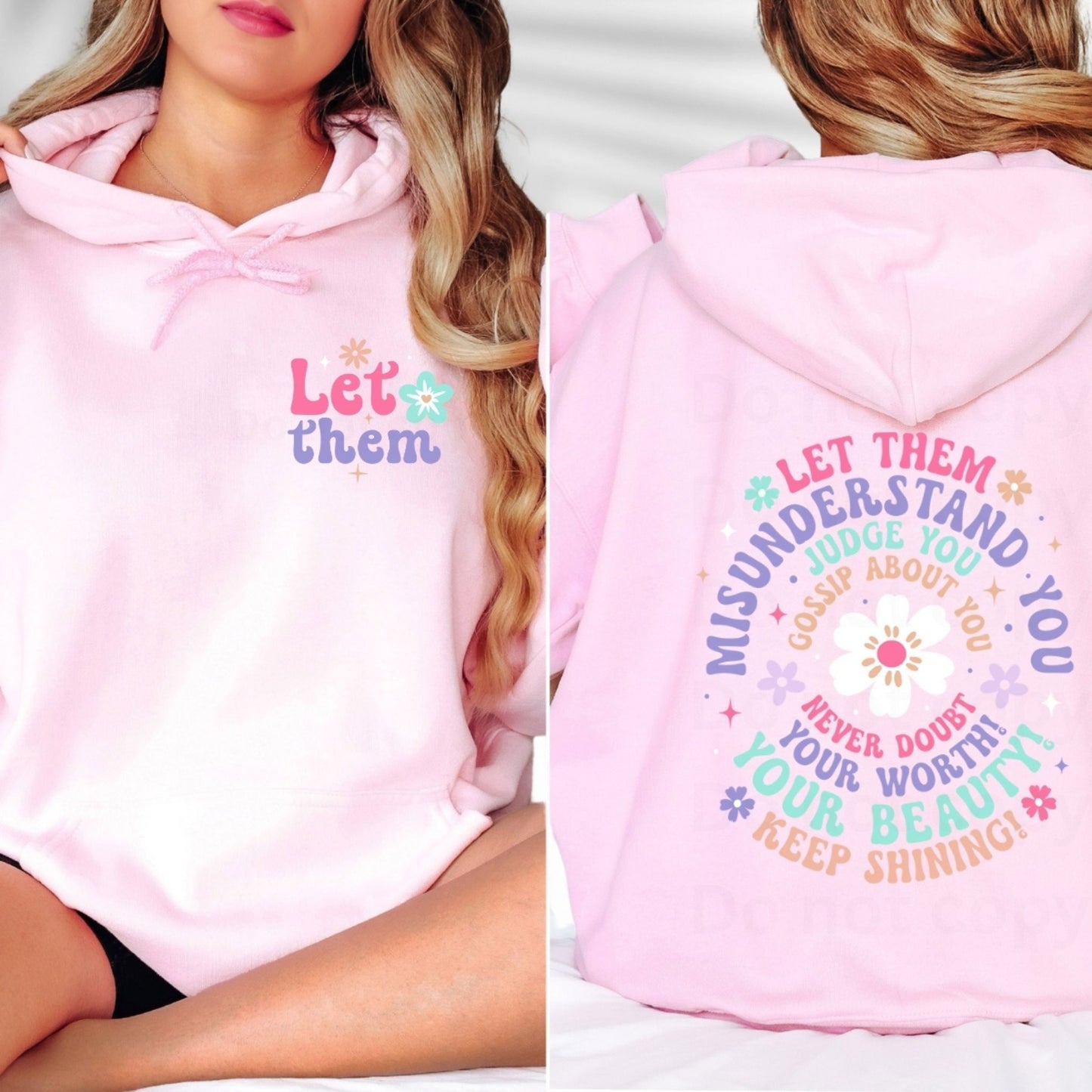 Pink hoodie with motivational let them quote on front and back for empowered feminine fashion