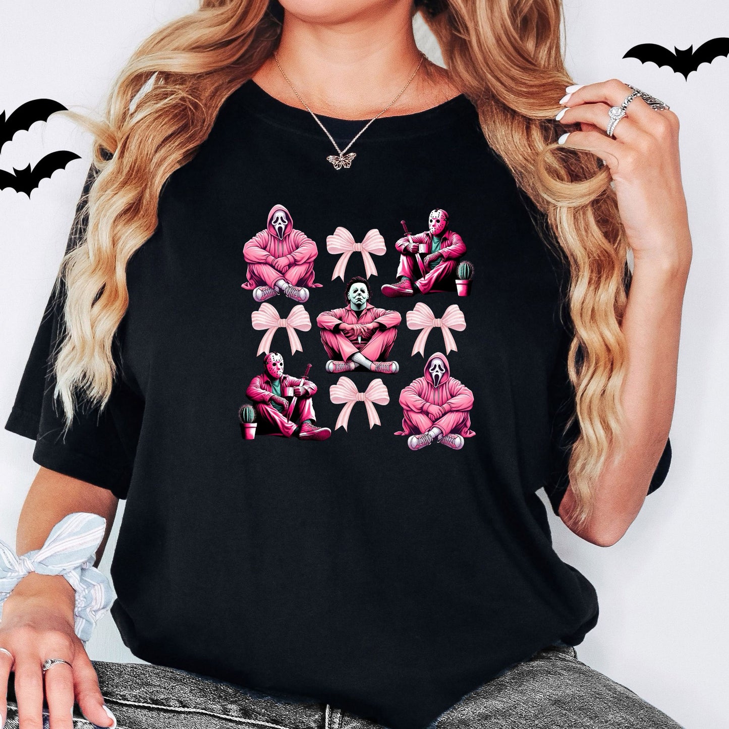 Black softsstyle Gildan tee with horror characters and pink accents