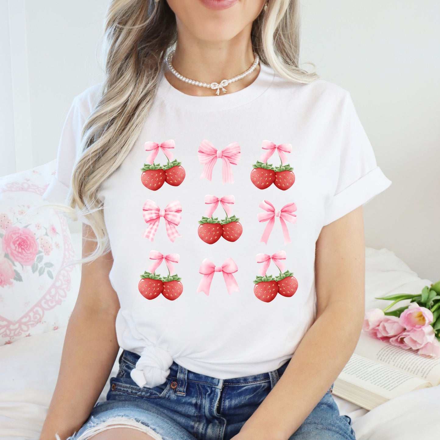 White t-shirt with strawberry and bow graphics for coquette aesthetic fashion
