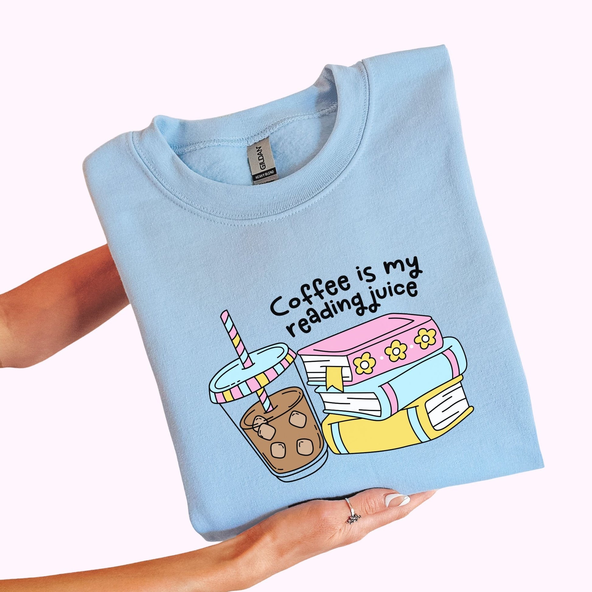 Light blue bookish graphic t-shirt and crewneck sweatshirt with books and iced coffee reading design