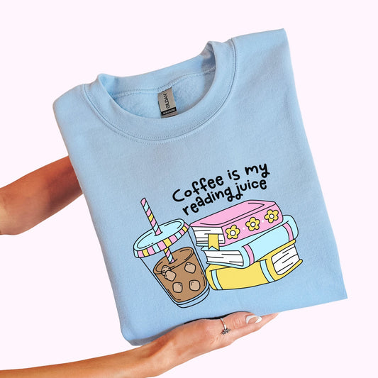 Light blue bookish graphic t-shirt and crewneck sweatshirt with books and iced coffee reading design