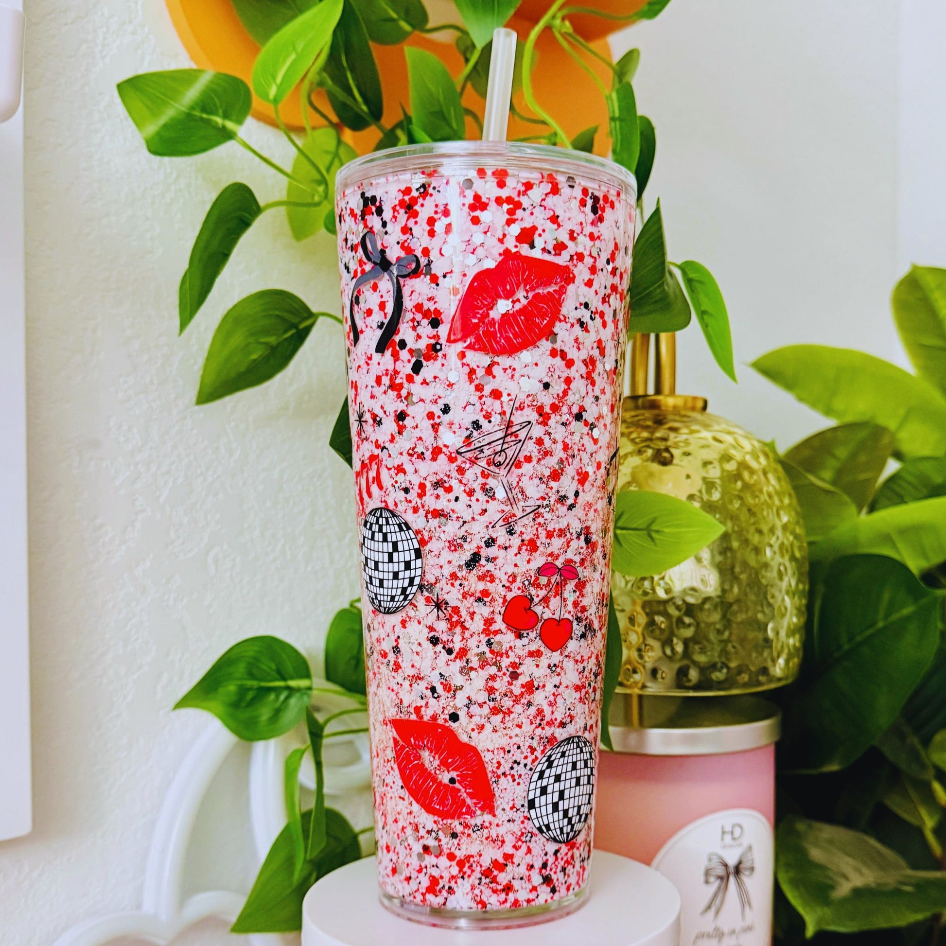 Handmade 24 oz glitter snow globe tumbler featuring red lips, disco balls, cherries and premium UV-DTF wrap